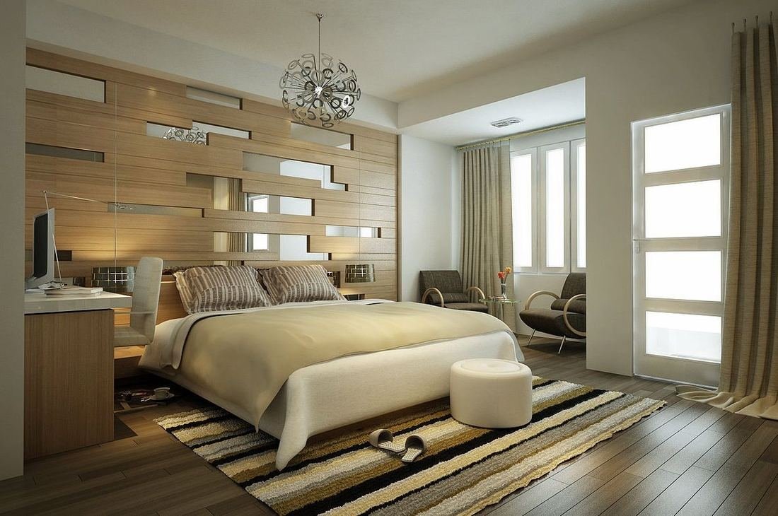 Bedroom with a slatted wooden bed back wall, built-in study desk and soft natural light